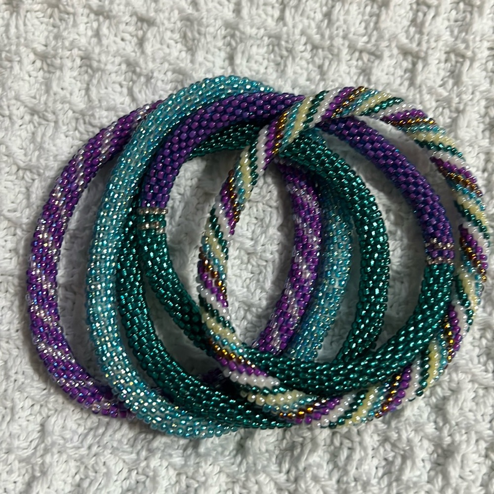 5 Sashka Co beaded bracelets. Suicide prevention colors teal/purple. Approx 8”.